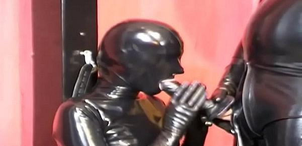 Black latex and rubber cock